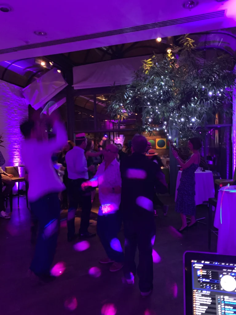 Bar Mitzvah dancefloor with colourful lighting and guests dancing.