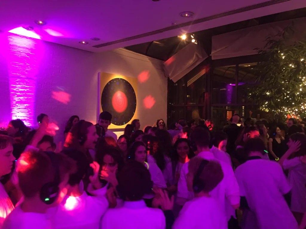 Silent disco dancefloor at a Bar Mitzvah celebration with vibrant lighting.
