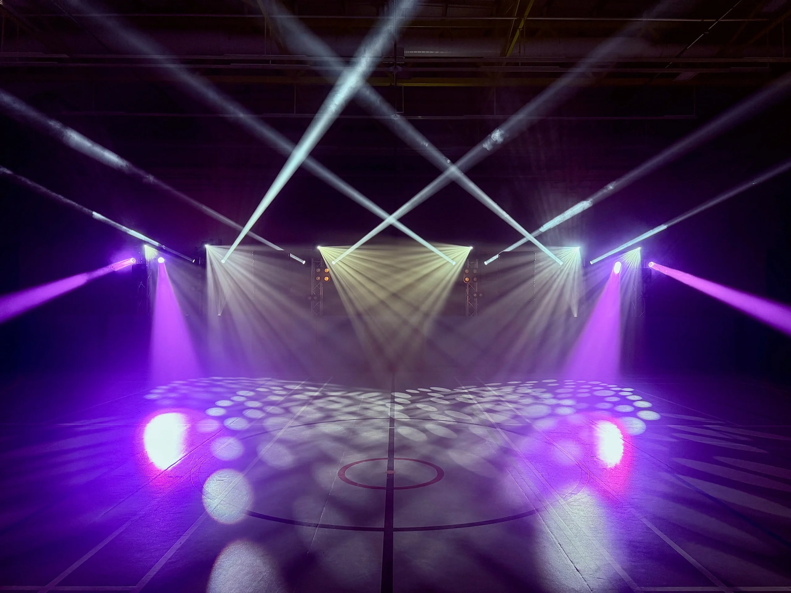Professional event lighting production in London with moving head lights and dynamic stage lighting effects