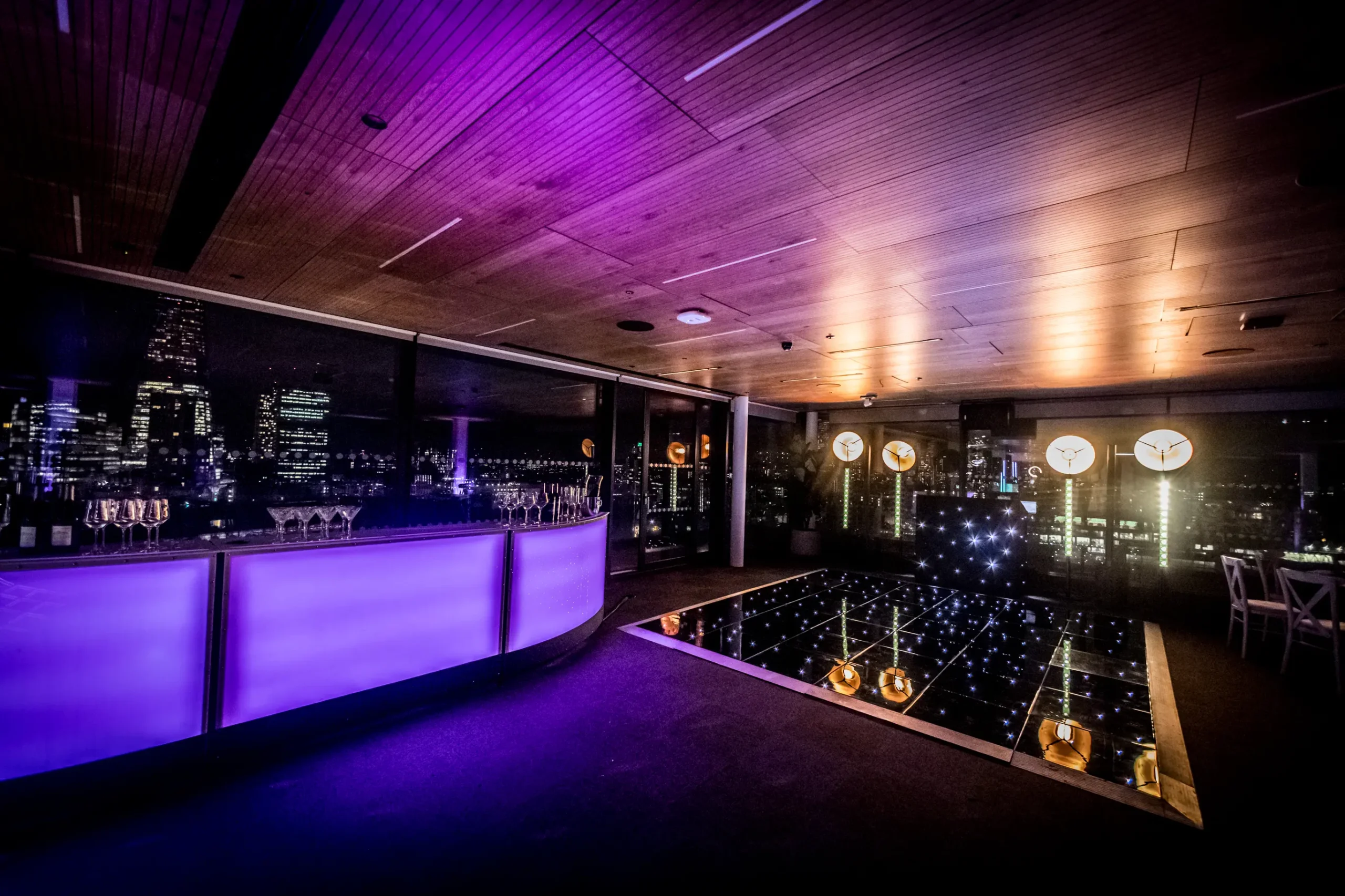 Corporate event production services in London with LED dancefloor, professional lighting, and venue transformation