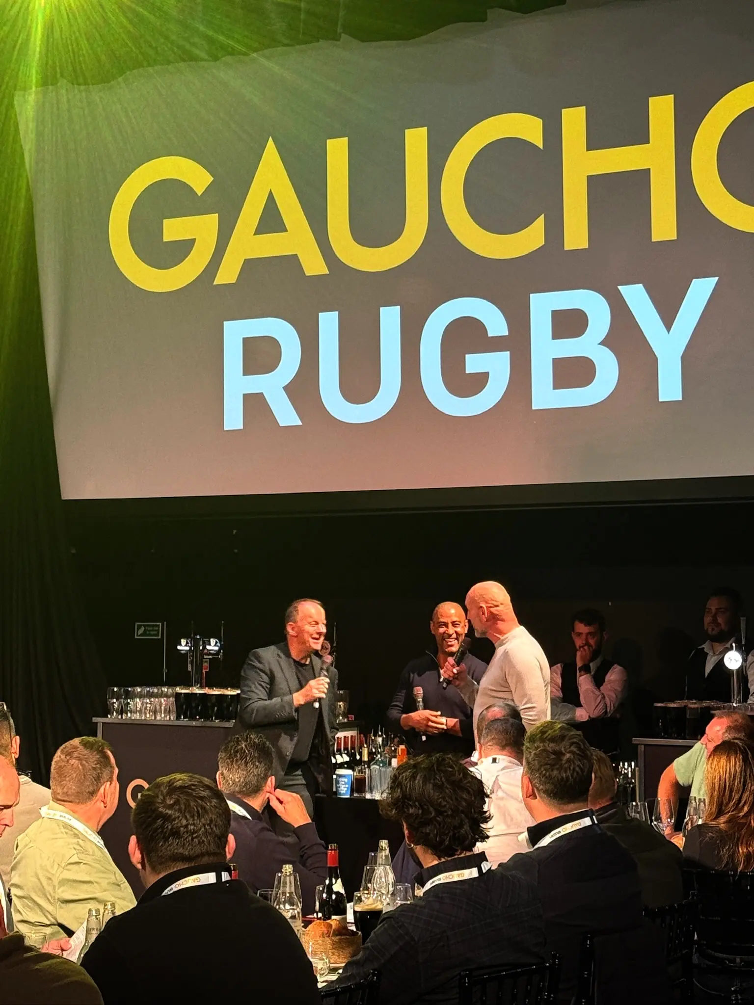 Laurence Dallaglio speaking on stage at Gaucho Rugby hospitality event with full corporate AV production