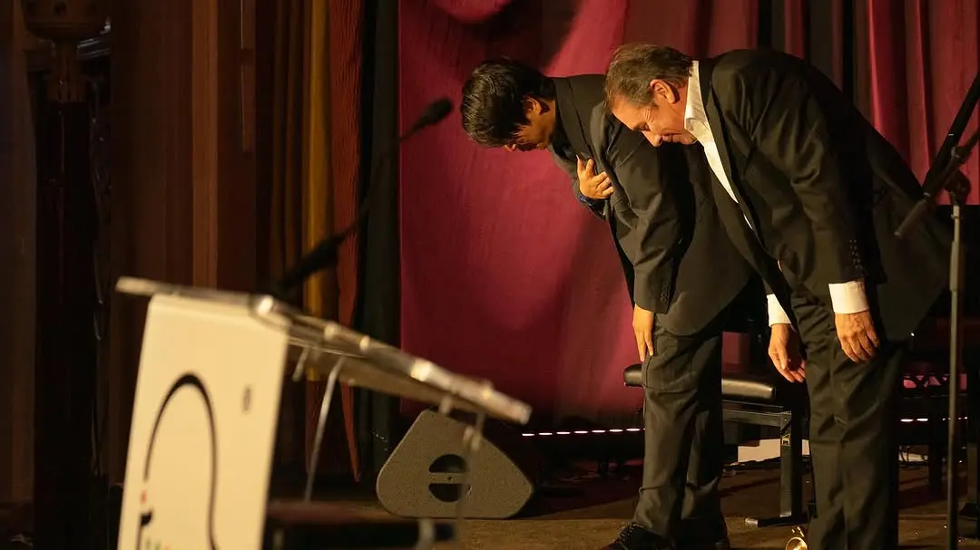 Lang Lang and Jools Holland taking a bow at Lang Lang Foundation gala dinner with full stage and AV production, London