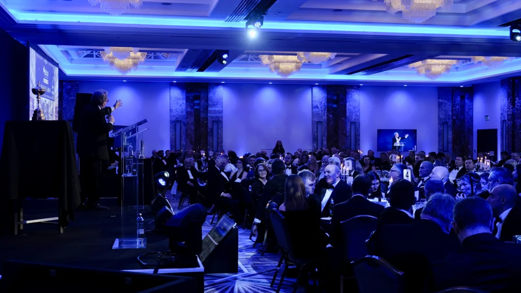 Keynote speaker on stage at Sporting Club Awards Gala 2025 at The Royal Lancaster London with full AV production and live screen relay