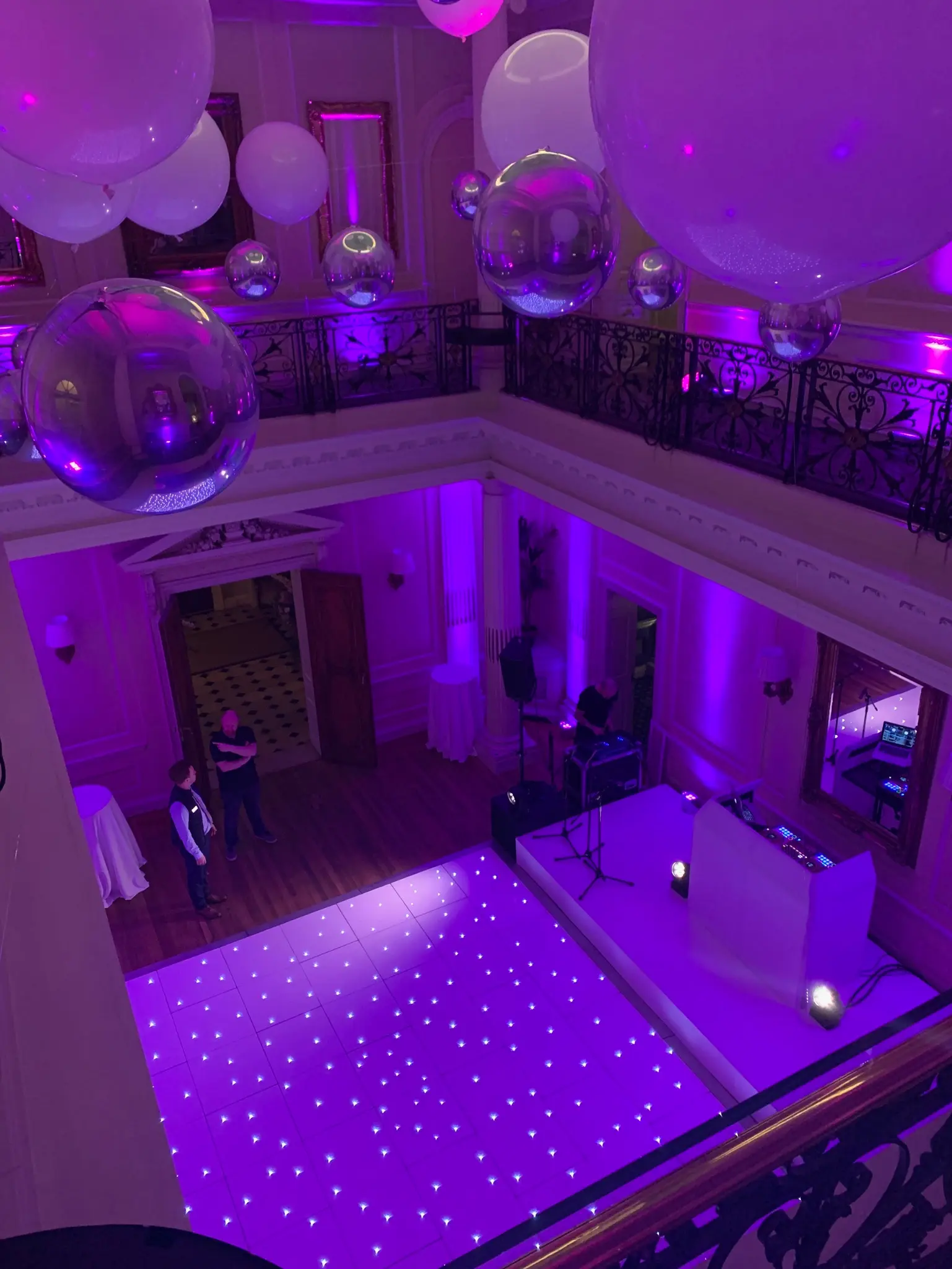 Overhead view of white starlit LED dance floor installed for luxury wedding reception with lighting and AV production in London