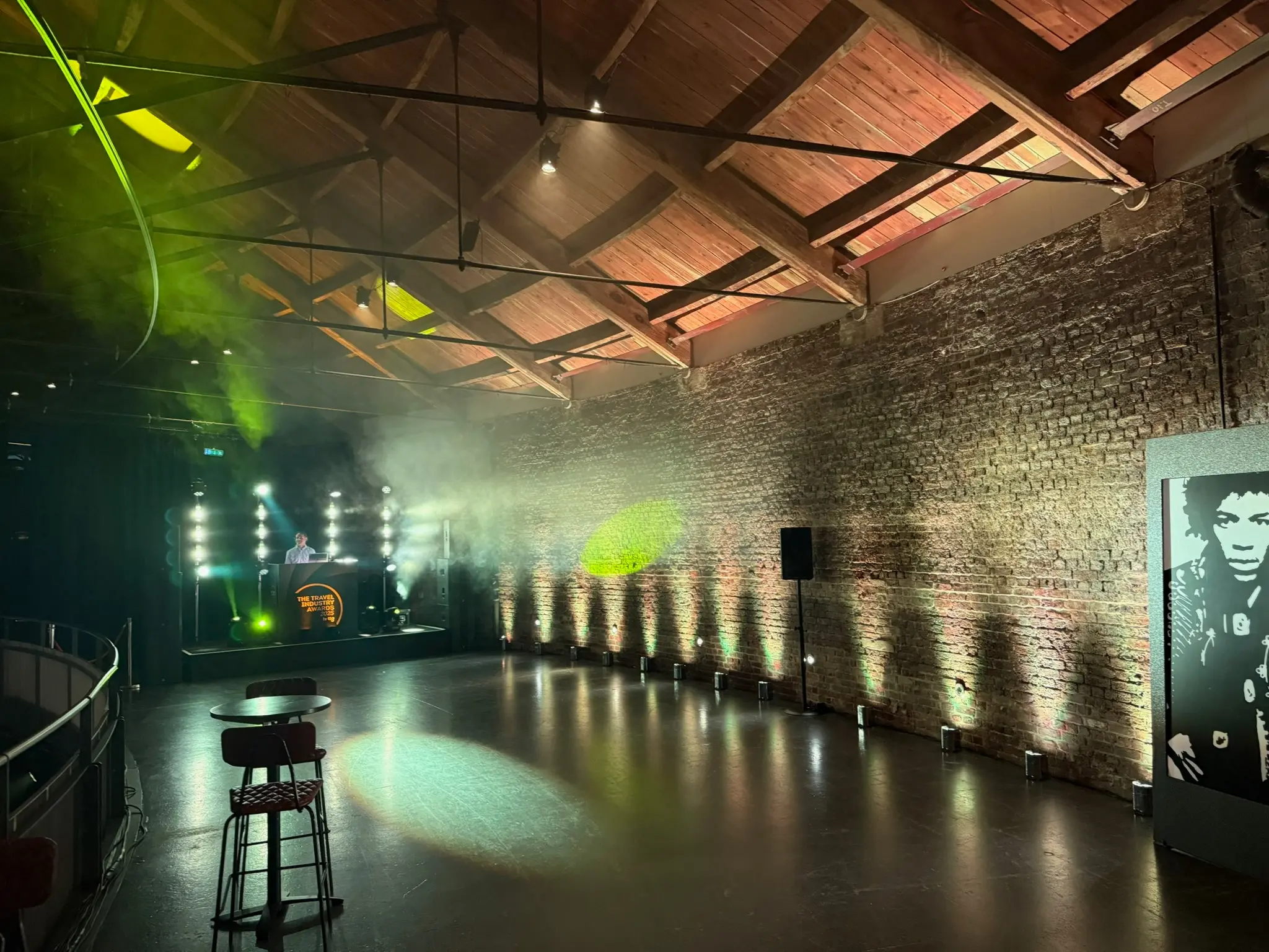 Wireless uplighters creating atmospheric event production lighting at corporate venue