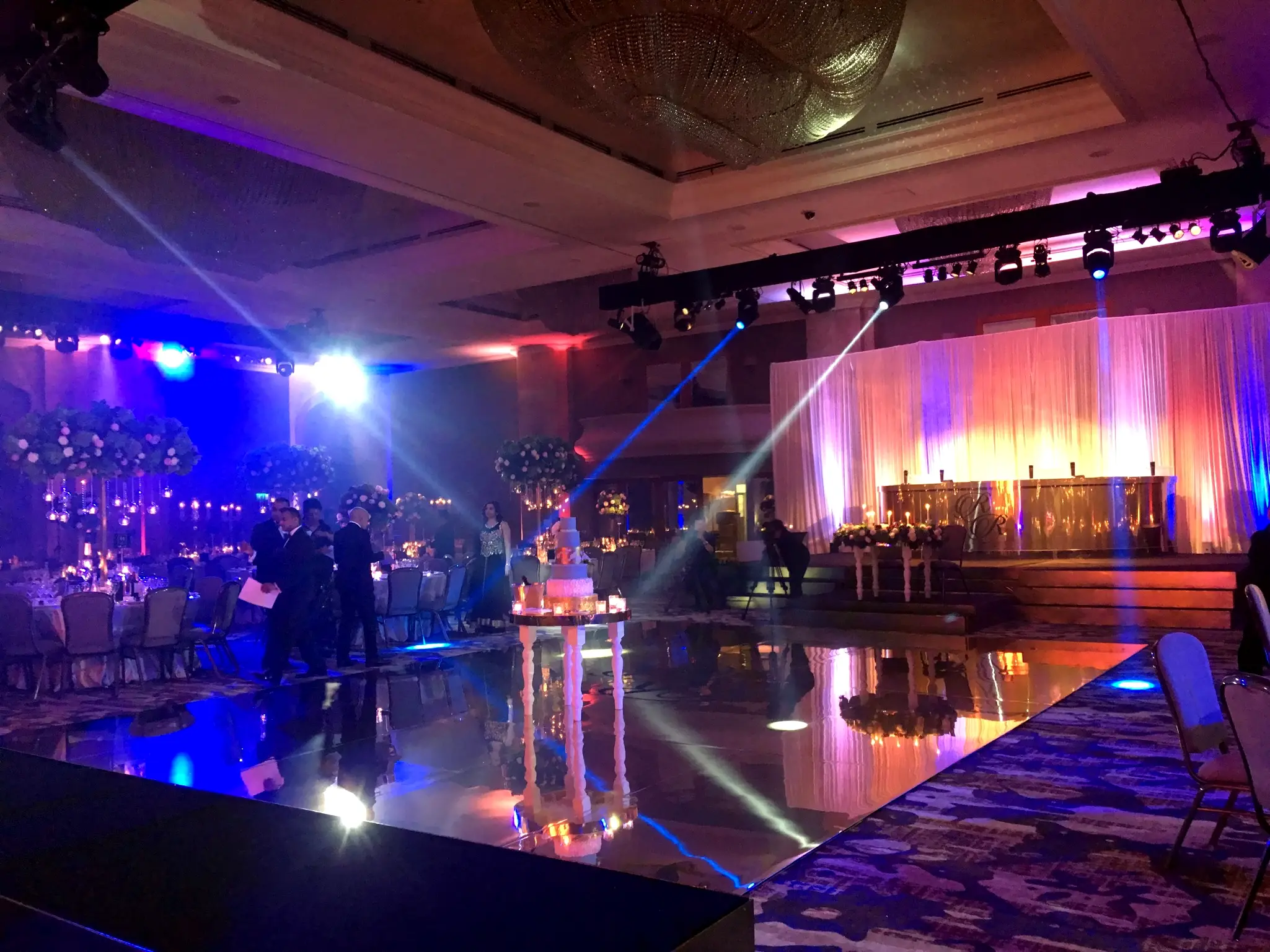 Mirrored dancefloor hire in London with wedding stage lighting and LED screen backdrop