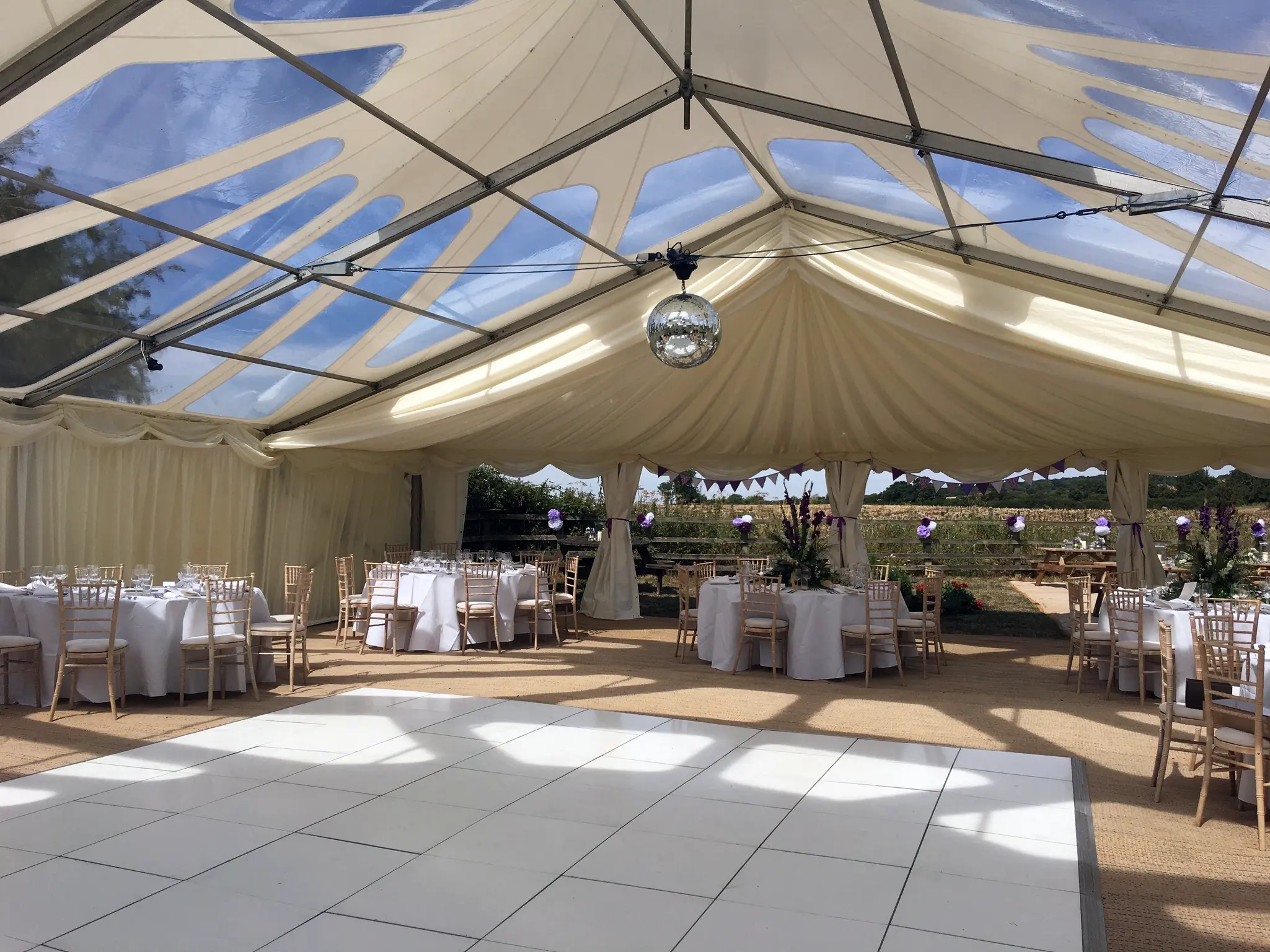 White wedding dancefloor hire in a marquee reception setup