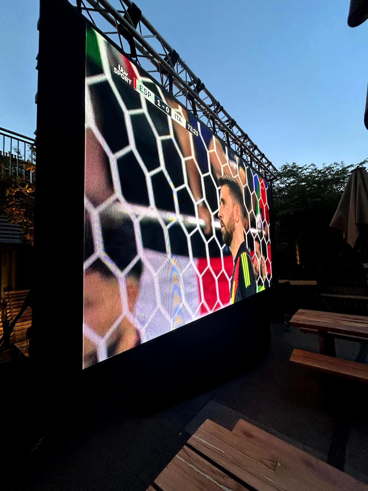 LED wall hire London outdoor event with large screen showing live sports content