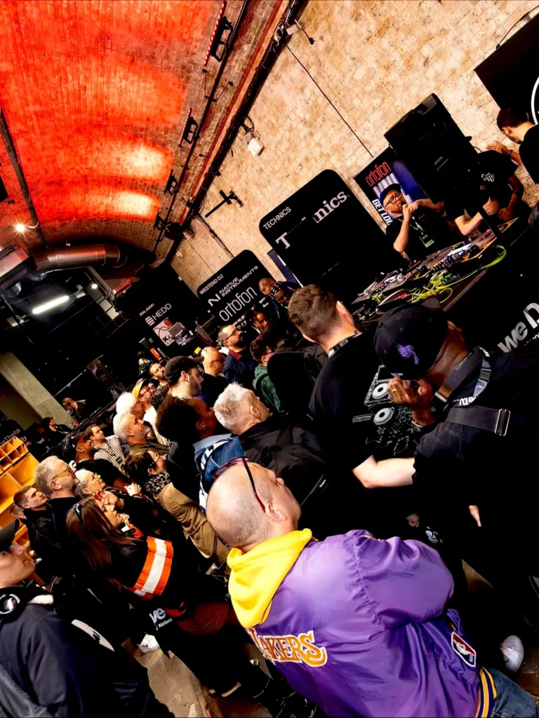 Crowd watching a live DJ demonstration