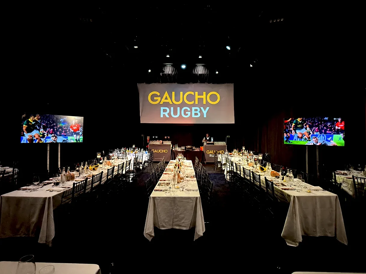 TV rental setup at Gaucho Rugby event with large screens on stands displaying live content