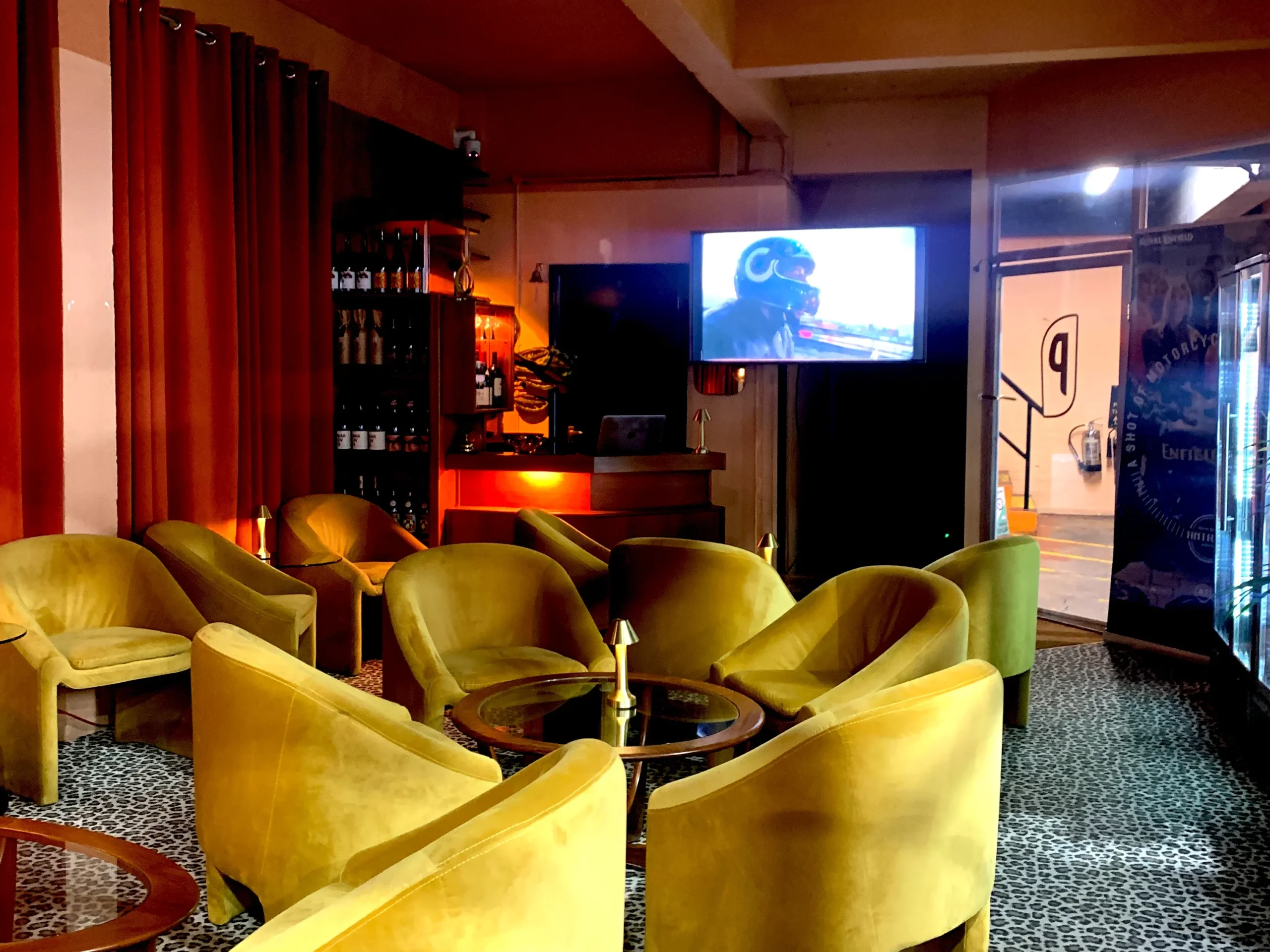 TV screen in lounge setting showing media display for private event