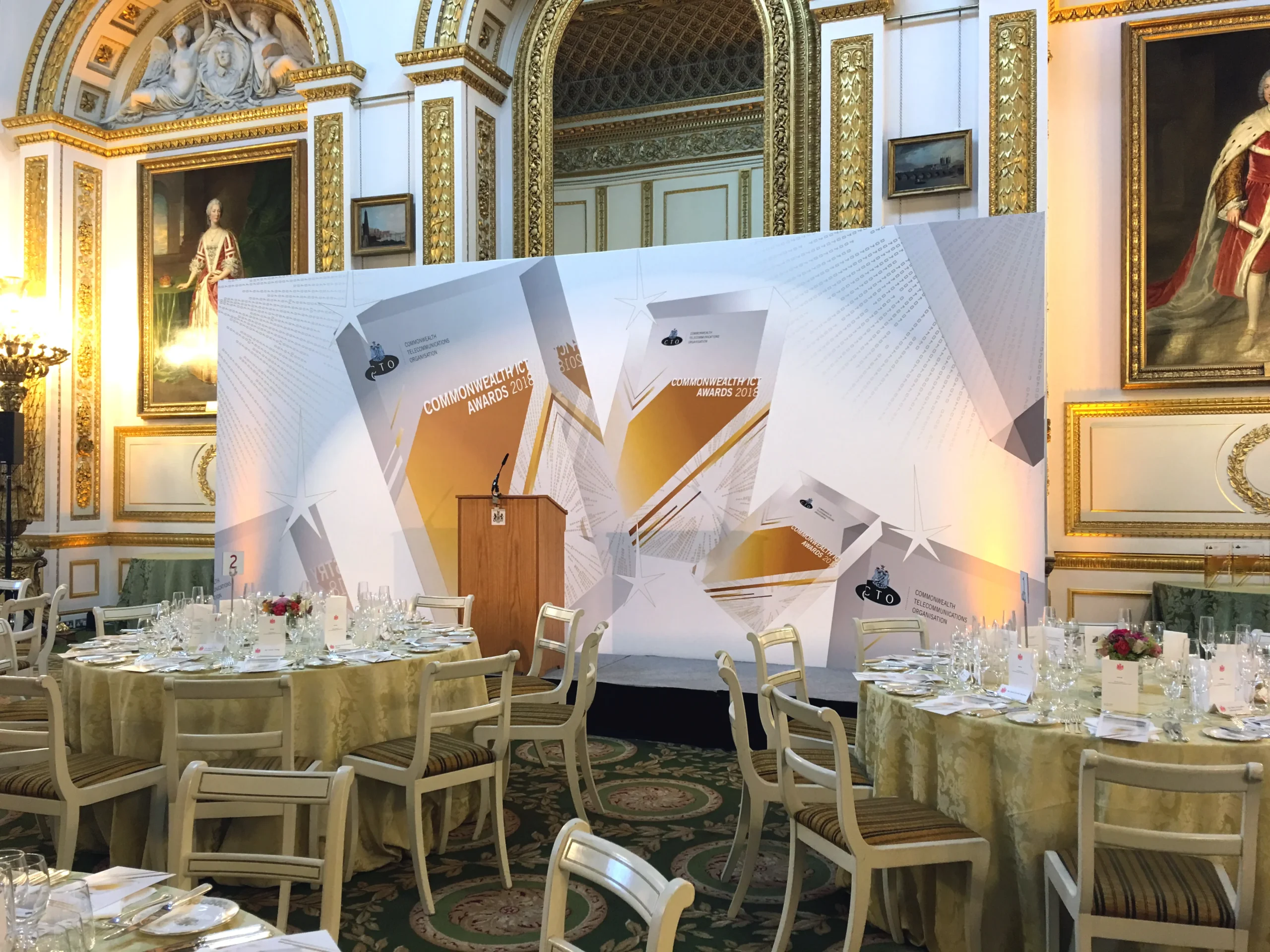 Branded photo wall and stage backdrop for the Commonwealth ICT Awards in London.