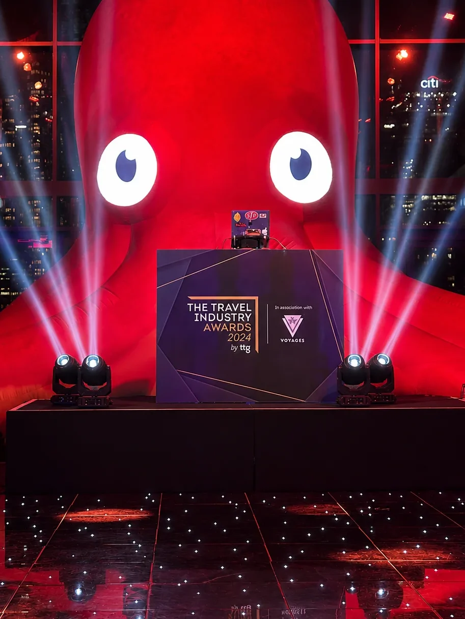 Custom DJ booth at the Travel Industry Awards in London with bespoke printed branding and event production.