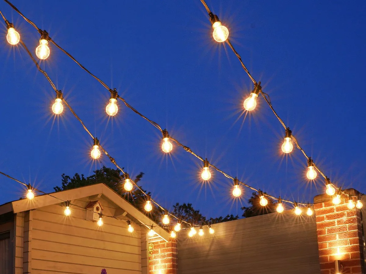Warm white commercial festoon lighting installed for an outdoor event
