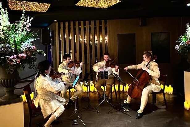 Professional string quartet performing live at an event in London.